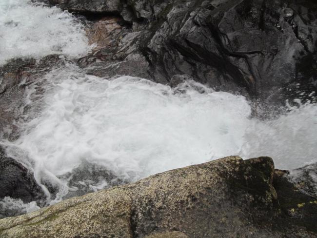 Noisy rapids at the bottom of the cliffs.