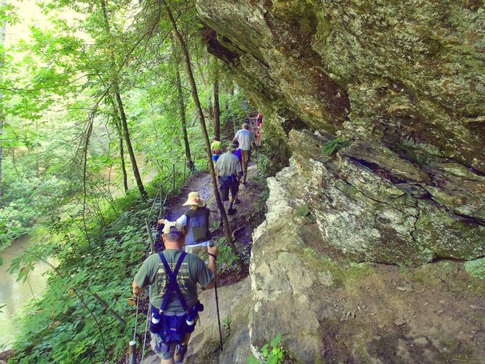 We hike alongside huge rock cliffs above Panther Creek.