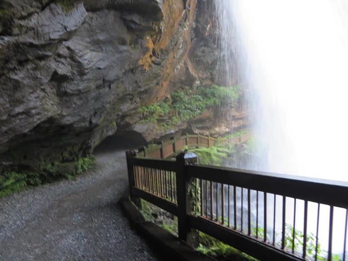 Walking behind the falls with cool mist!