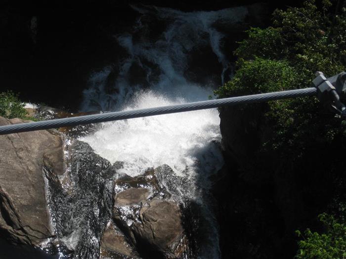 View from the suspension bridge looking down onto the upper part of Hurricane Falls.