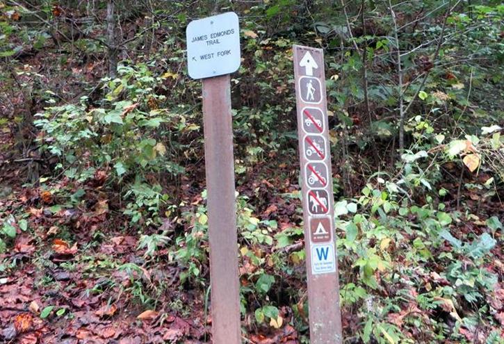 Next, we walk about 50 yards up the gravel road from the parking lot to the West Fork of the James Edmonds Trail.