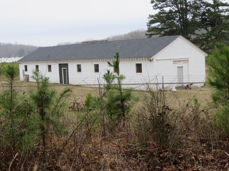 As we start up the hill, we see the only remaining structure from Camp Toccoa the Mess Hall (refurbished by the Stephens Co. Historical Society).