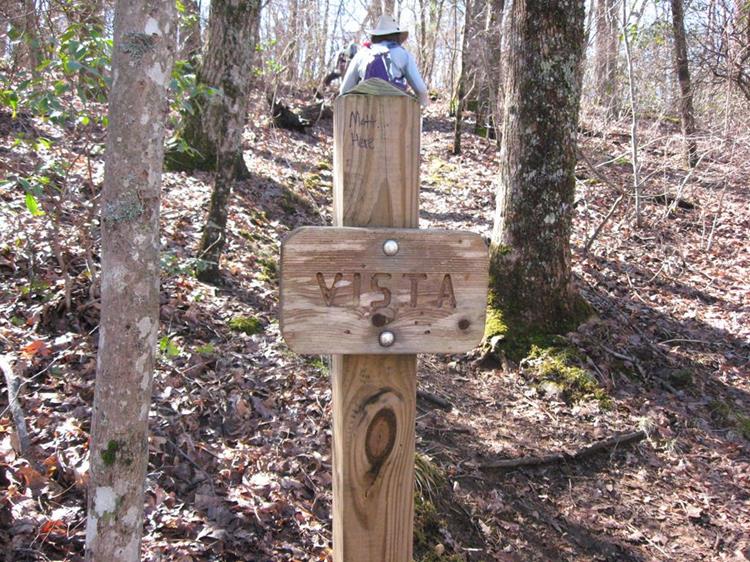 Sign for a side trail to a beautiful mountain vista.