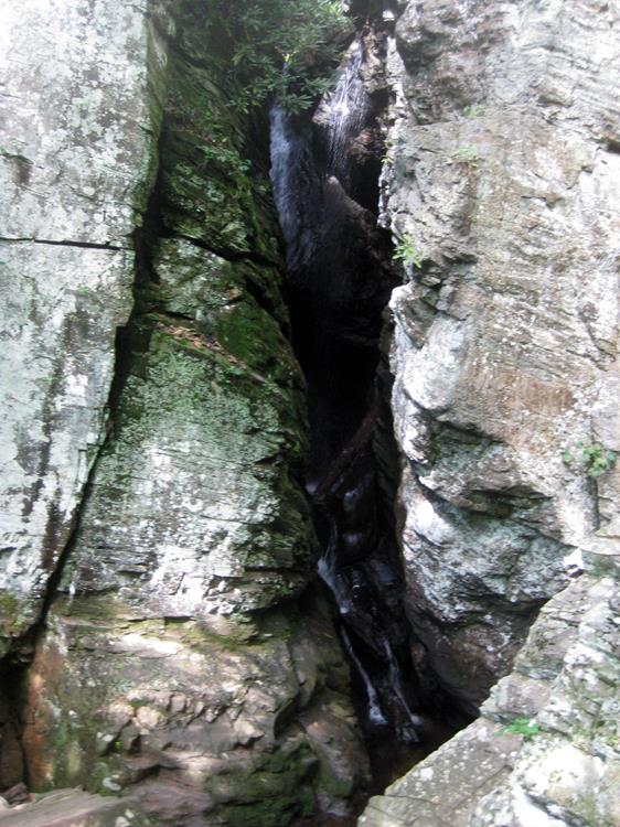 Raven Cliffs Falls tumbles between the split in the rock cliffs.