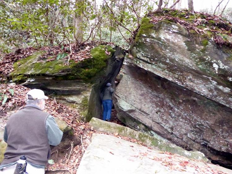 Exploring the giant boulders at the bottom of the falls.