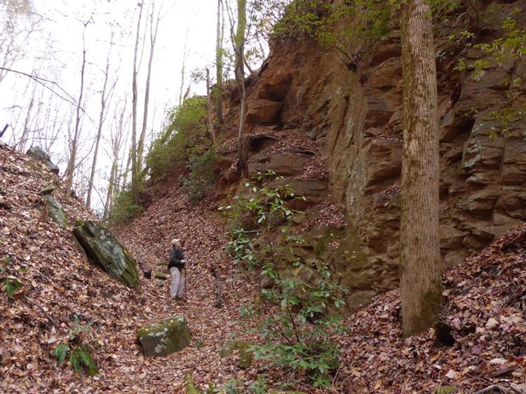 Walking through the giant cut in the mountain for the railroad.