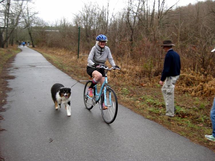 Lady and her dog enjoying the Greenway.