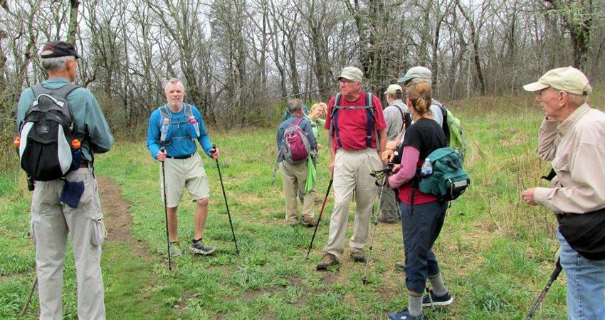 Taking a break at the base of the long grassy slope up to the summit.