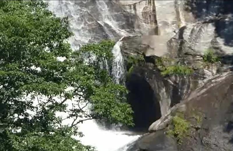 Near the top of the falls you can see a cave. This is a zoomed view. See video below!