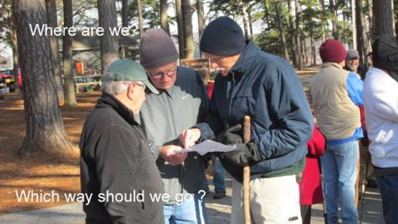 Checking the map to see which option to choose.