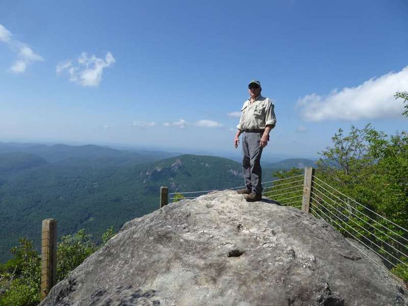 Vic is standing on the highest point of the mountain. 4,930 ft.