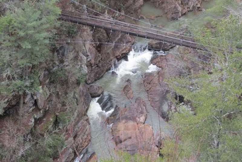 The suspension bridge over the gorge.